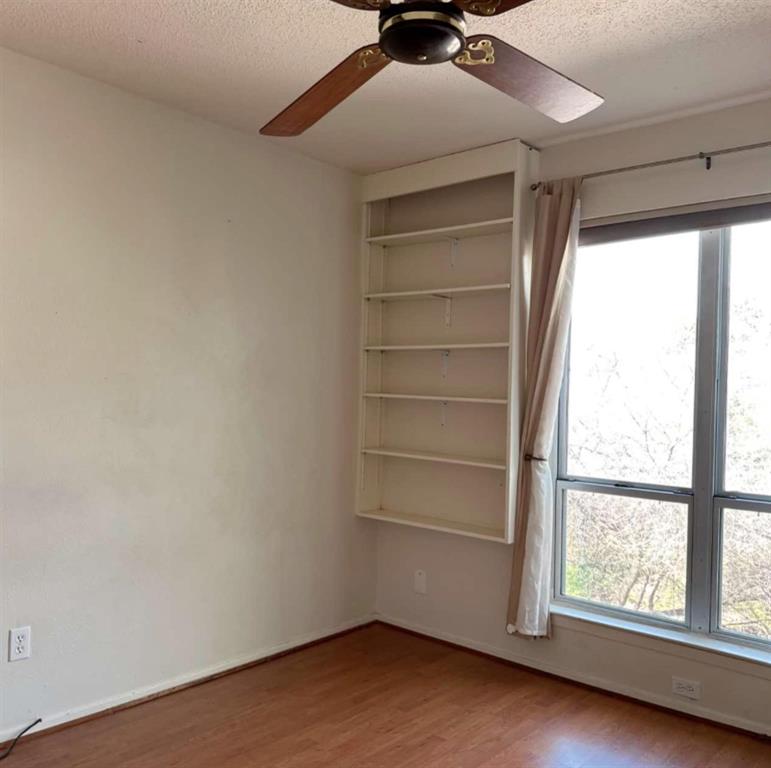 4845 Cedar Springs Road, Unit 267 Dallas, TX 75219 - Photo 11 of 17 a view of an empty room with a window