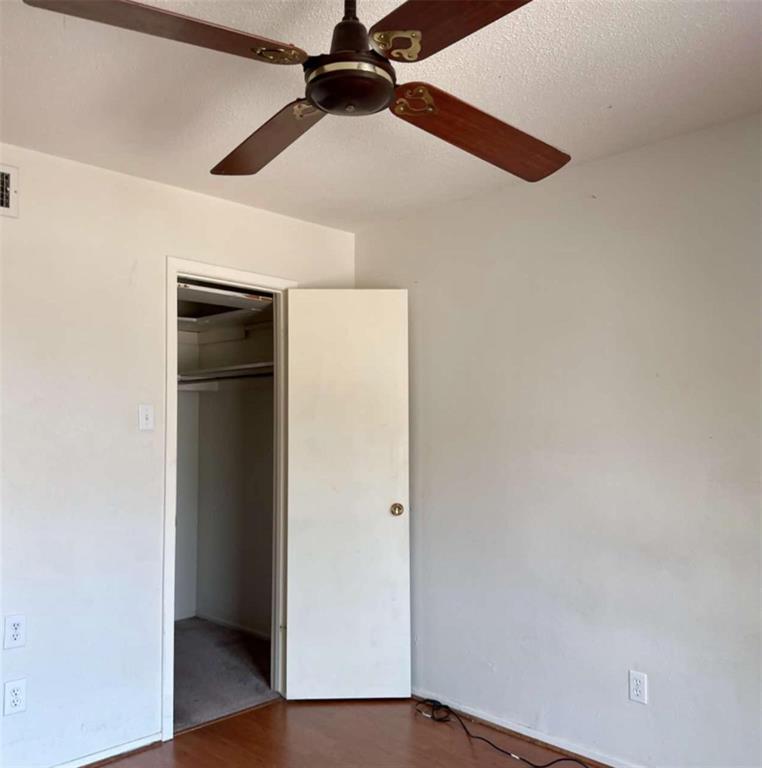 4845 Cedar Springs Road, Unit 267 Dallas, TX 75219 - Photo 13 of 17 wooden floor in an empty room