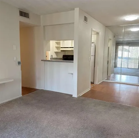 a view of a kitchen with a sink