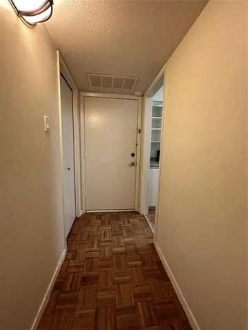 wooden floor and window in an empty room