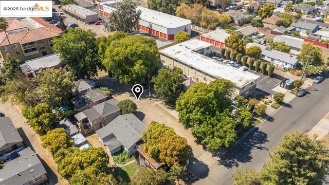 an aerial view of a house with a yard