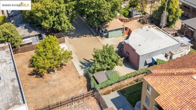 an aerial view of a house with a yard and garden
