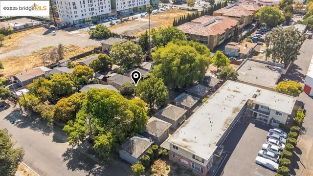 an aerial view of a house with a yard and garden