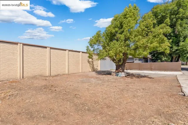 a view of a house with a yard and garage