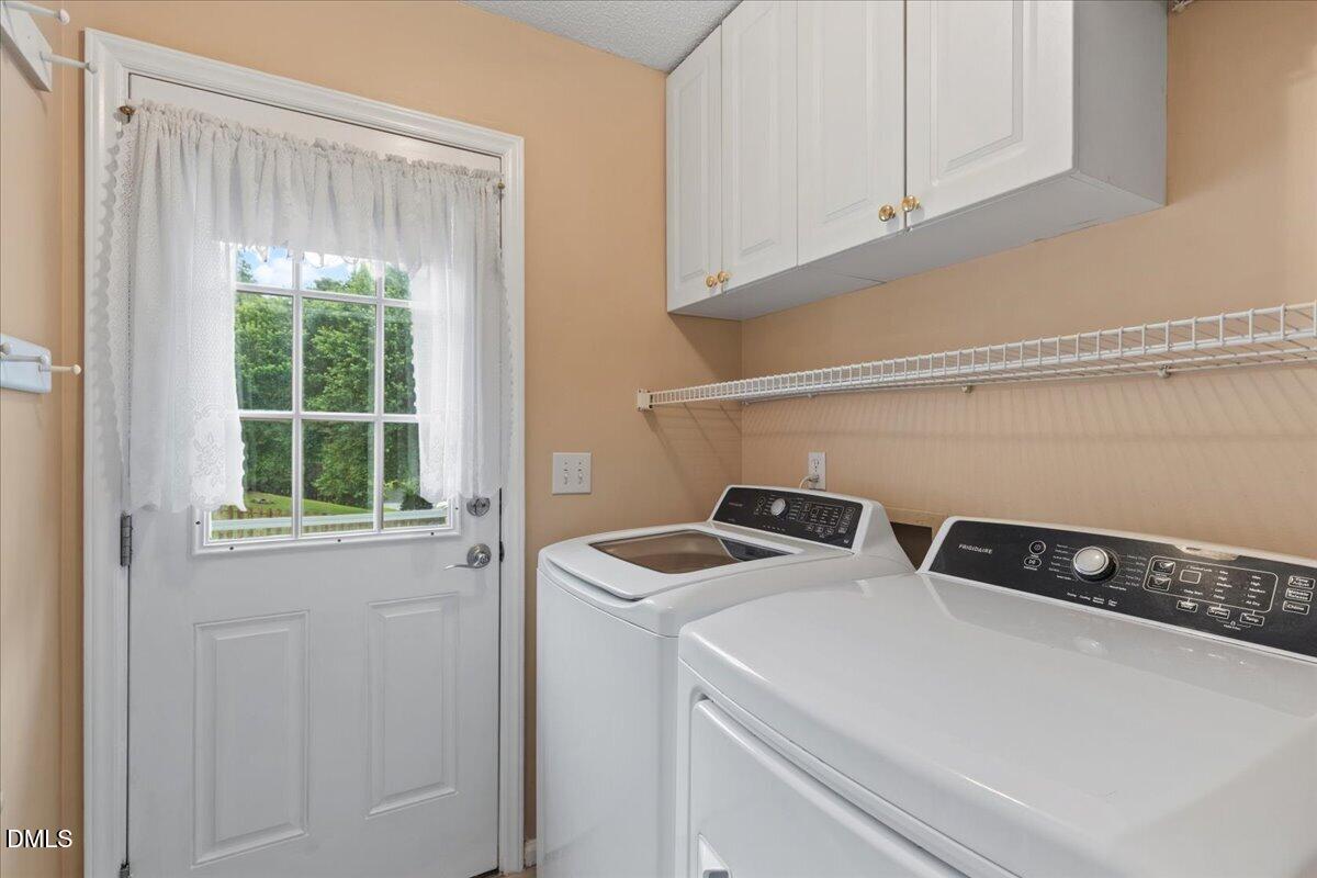 4317 South Mountain Drive Raleigh, NC 27603 - Photo 17 of 57 a utility room with dryer and washer