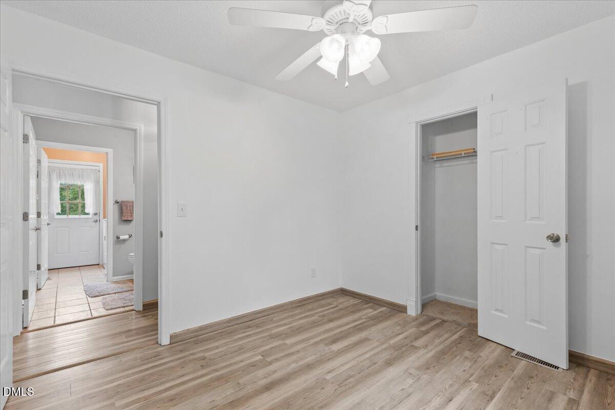 4317 South Mountain Drive Raleigh, NC 27603 - Photo 18 of 57 a view of empty room with wooden floor