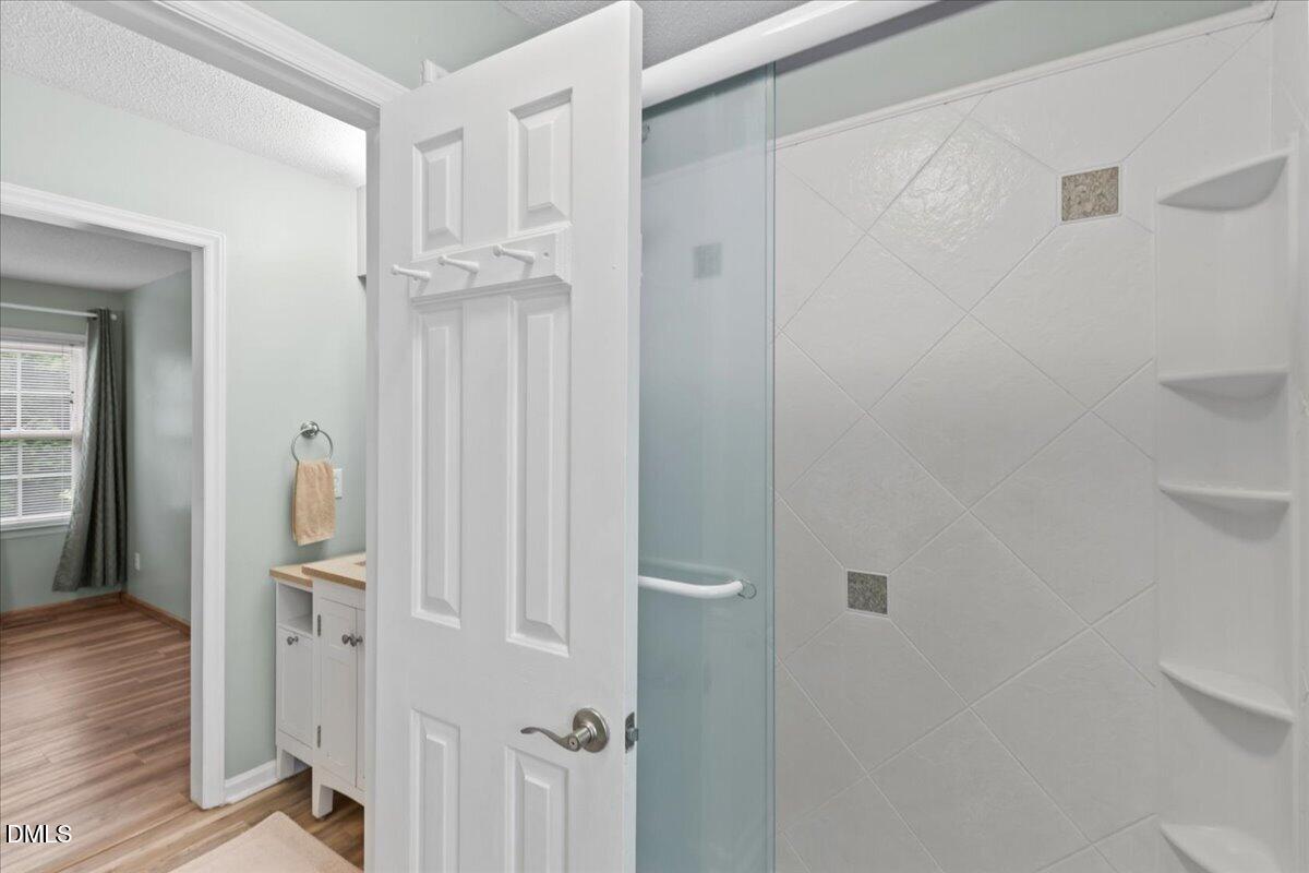 4317 South Mountain Drive Raleigh, NC 27603 - Photo 25 of 57 a view of a hallway with wooden floor and staircase