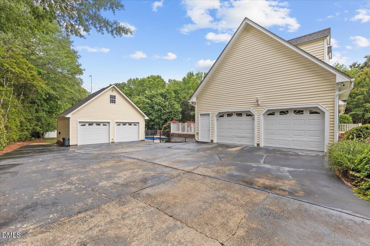 4317 South Mountain Drive Raleigh, NC 27603 - Photo 36 of 57 a view of a house with a yard and garage