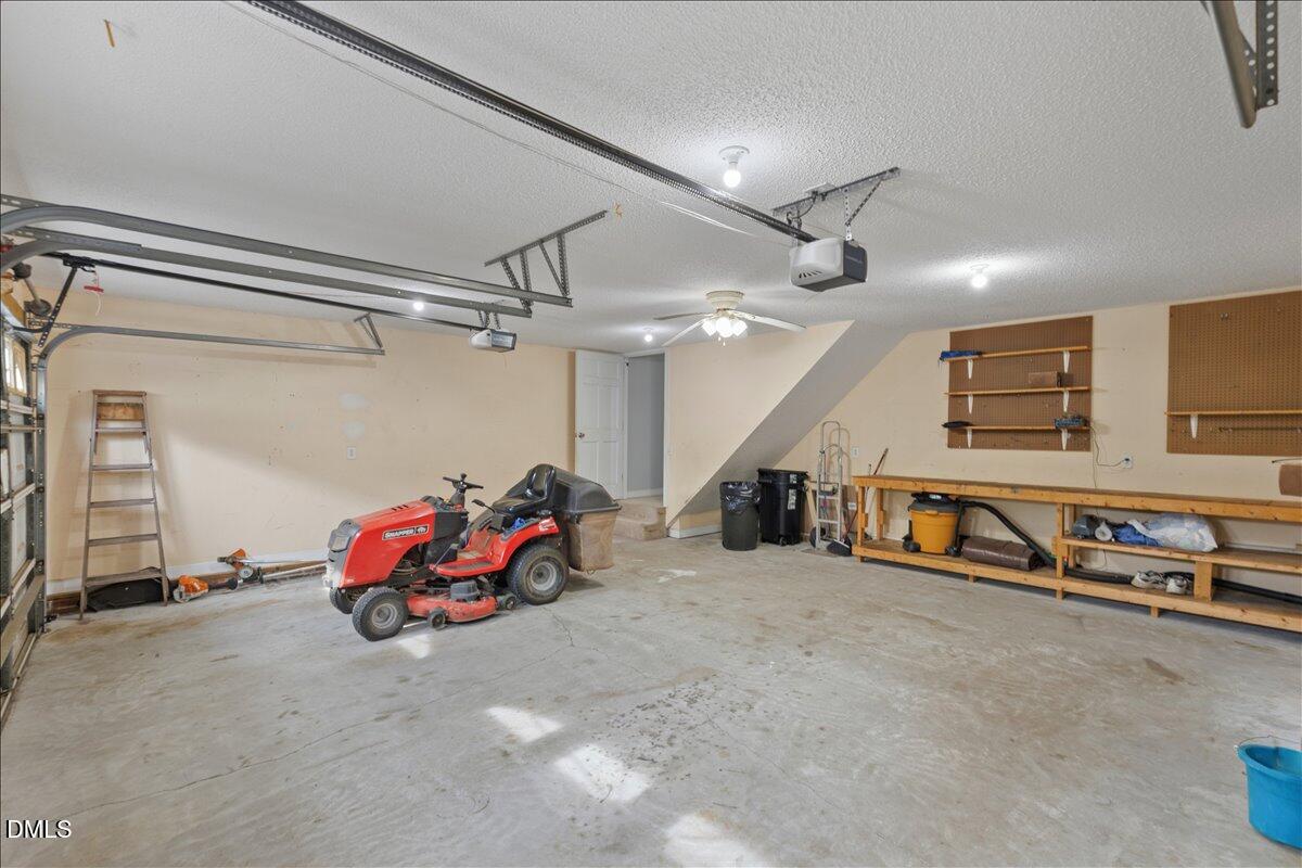 4317 South Mountain Drive Raleigh, NC 27603 - Photo 38 of 57 a view of a garage with gym equipment