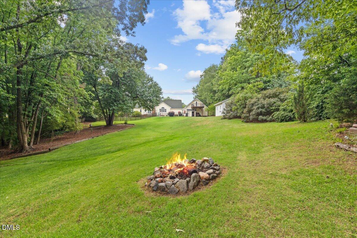 4317 South Mountain Drive Raleigh, NC 27603 - Photo 46 of 57 a view of a golf course with a garden