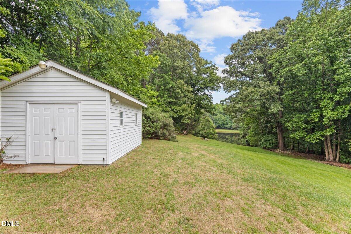 4317 South Mountain Drive Raleigh, NC 27603 - Photo 49 of 57 a view of a backyard with a garden