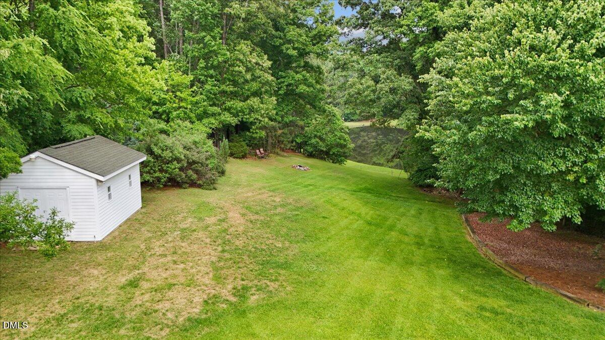 4317 South Mountain Drive Raleigh, NC 27603 - Photo 50 of 57 a view of an outdoor space and a yard