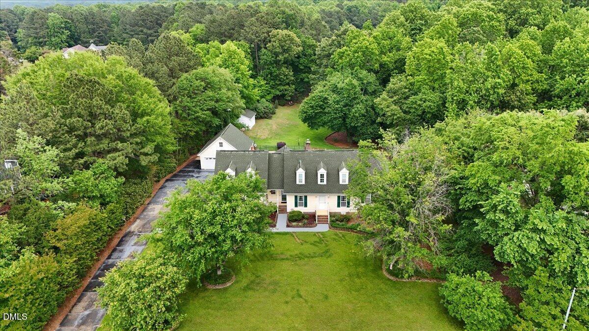 4317 South Mountain Drive Raleigh, NC 27603 - Photo 51 of 57 a front view of a house with lots of green space