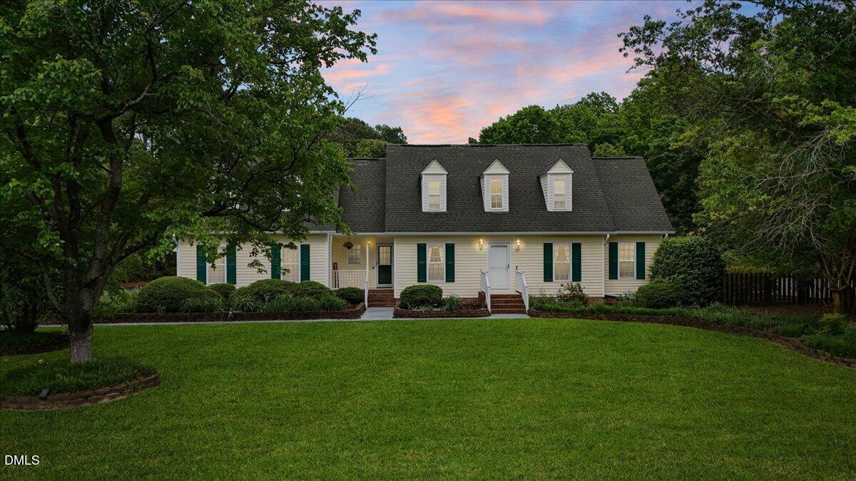 4317 South Mountain Drive Raleigh, NC 27603 - Photo 54 of 57 a front view of a house with a yard