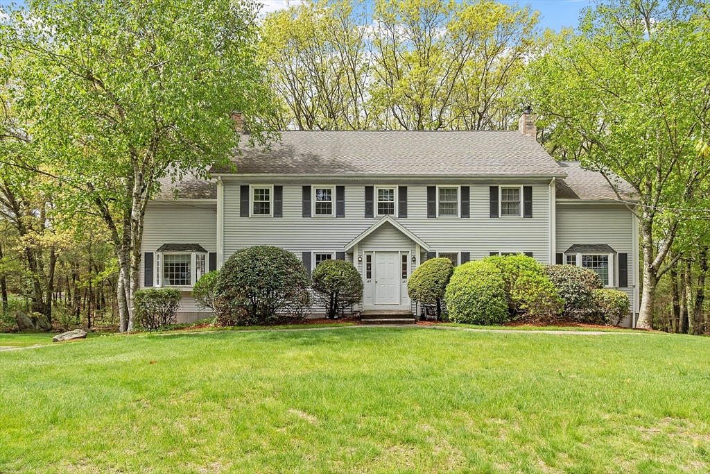 front view of a house with a yard
