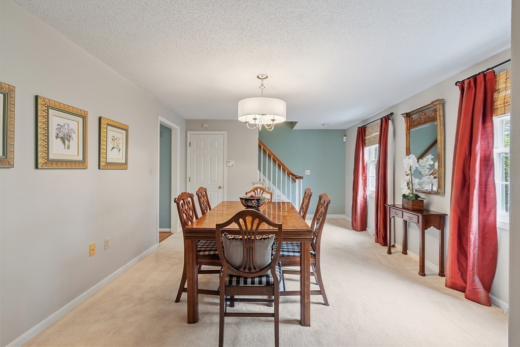 187 Turnpike Road, Unit 187 Chelmsford, MA 01824 - Photo 14 of 42 a dining room with furniture and window