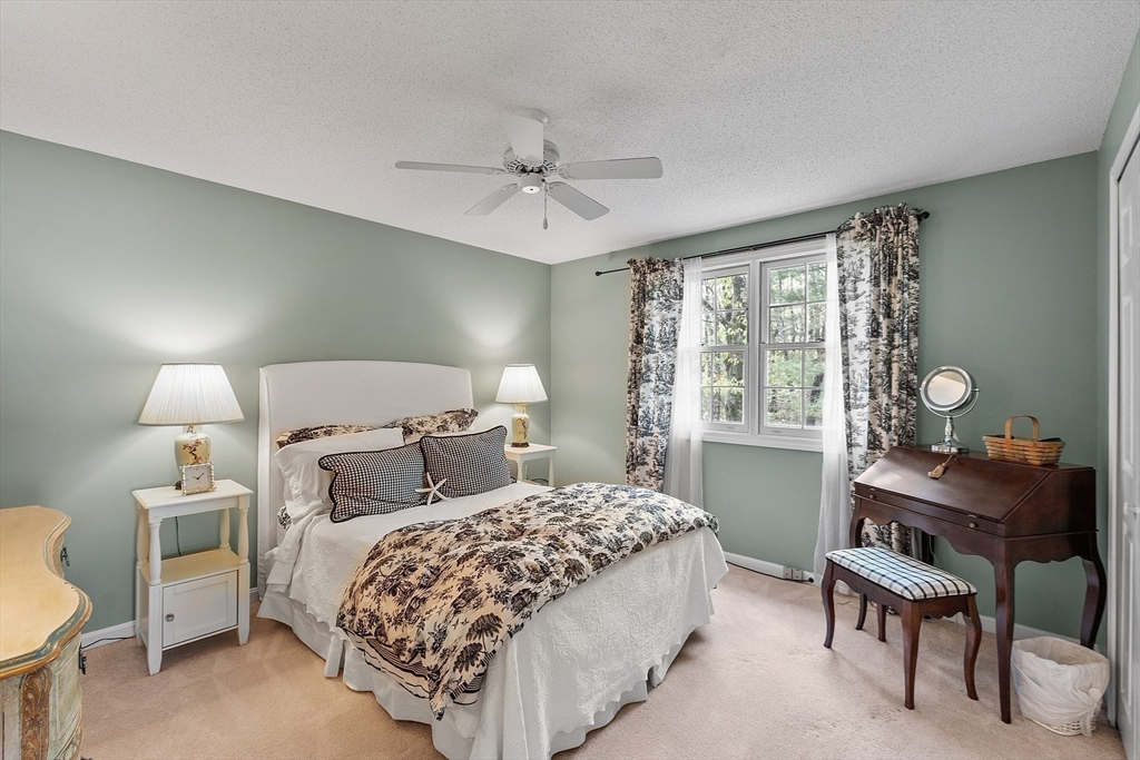187 Turnpike Road, Unit 187 Chelmsford, MA 01824 - Photo 21 of 42 a bedroom with a bed and a window