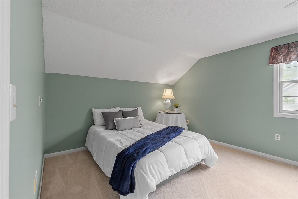 187 Turnpike Road, Unit 187 Chelmsford, MA 01824 - Photo 24 of 42 a bedroom with a bed and window