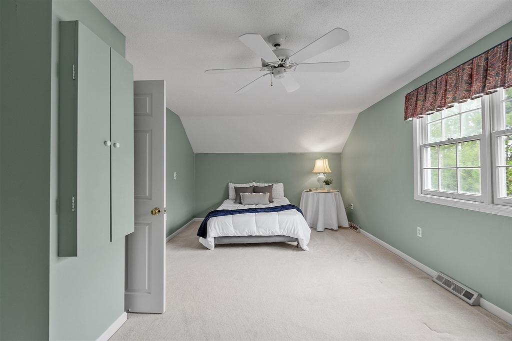 187 Turnpike Road, Unit 187 Chelmsford, MA 01824 - Photo 25 of 42 a room with a bed and window