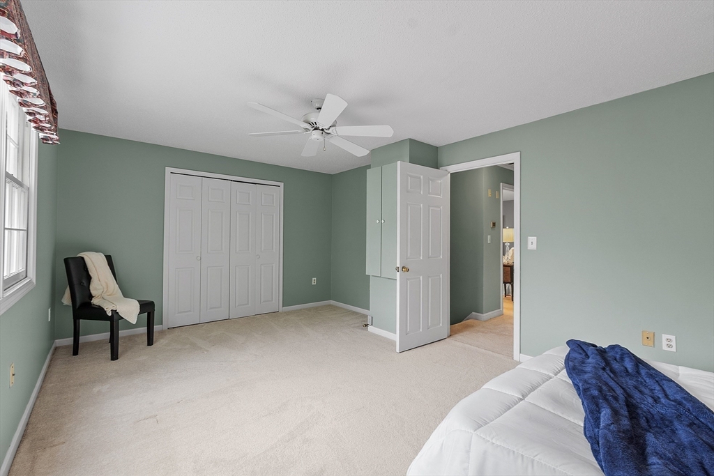 187 Turnpike Road, Unit 187 Chelmsford, MA 01824 - Photo 26 of 42 a bedroom with a bed furniture and a window