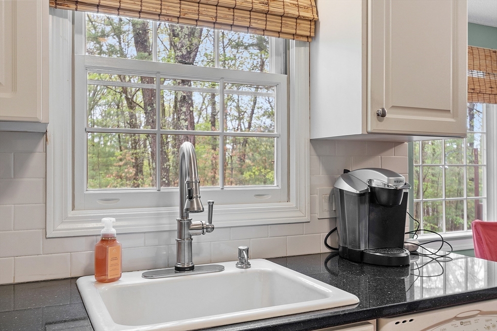 187 Turnpike Road, Unit 187 Chelmsford, MA 01824 - Photo 4 of 42 a bathroom with a sink and a window