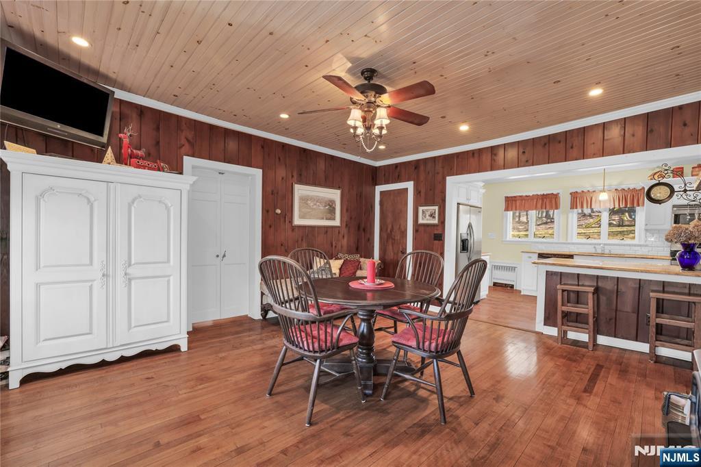 265 Little Falls Road Cedar Grove, NJ 07009 - Photo 16 of 49 a view of a dining room with furniture and wooden floor