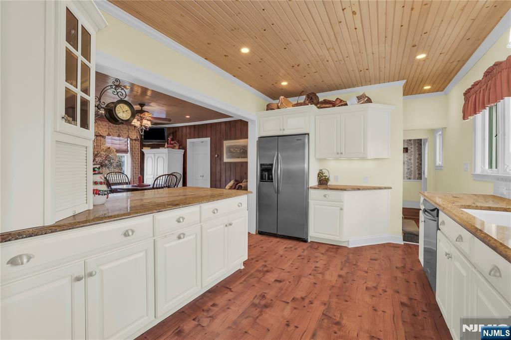 265 Little Falls Road Cedar Grove, NJ 07009 - Photo 21 of 49 a kitchen with white cabinets and sink