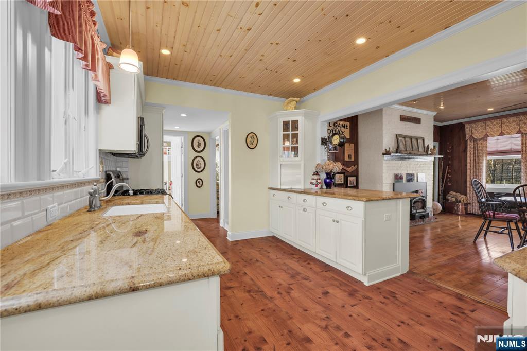 265 Little Falls Road Cedar Grove, NJ 07009 - Photo 22 of 49 a living room with furniture and a flat screen tv