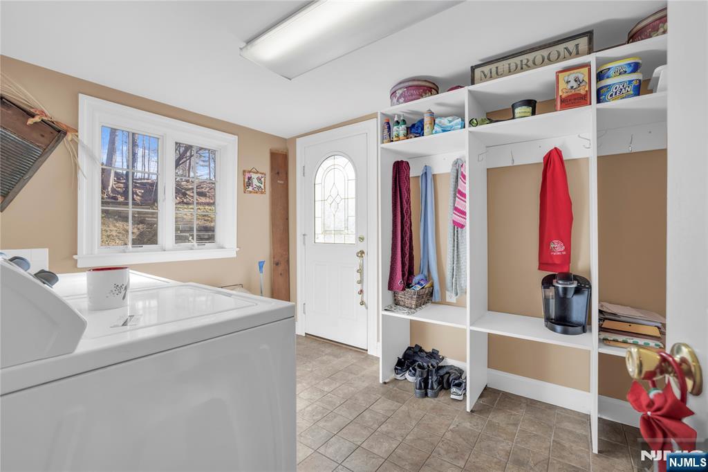 265 Little Falls Road Cedar Grove, NJ 07009 - Photo 24 of 49 a view of walk in closet with clothes and shoes