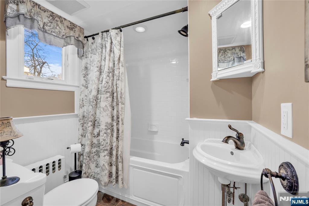 265 Little Falls Road Cedar Grove, NJ 07009 - Photo 25 of 49 a bathroom with a sink a toilet and shower