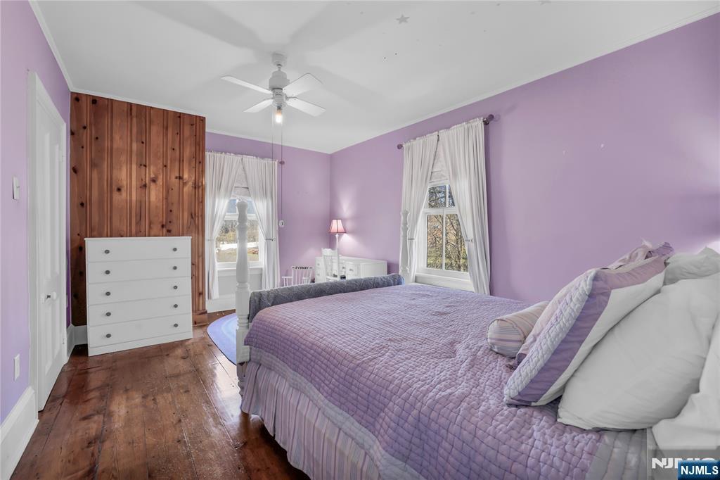 265 Little Falls Road Cedar Grove, NJ 07009 - Photo 34 of 49 a bedroom with a bed and a chair