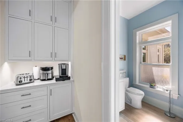 a bathroom with a toilet a sink and tub