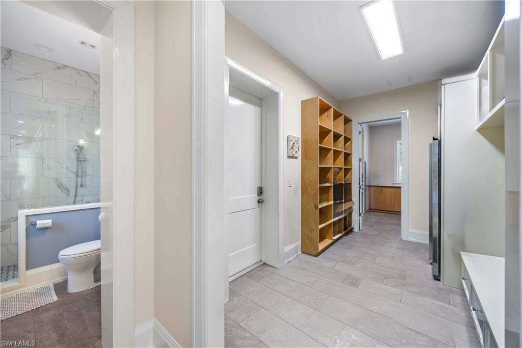 4885 Tamarind Ridge Drive Naples, FL 34119 - Photo 27 of 39 a view of an empty room and a bathroom
