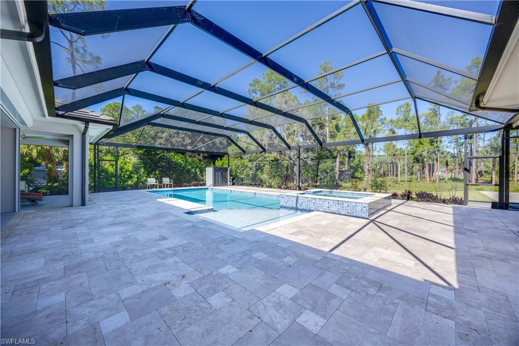 4885 Tamarind Ridge Drive Naples, FL 34119 - Photo 29 of 39 a view of yard with porch