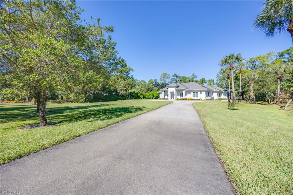 4885 Tamarind Ridge Drive Naples, FL 34119 - Photo 34 of 39 a view of a park with plants and trees
