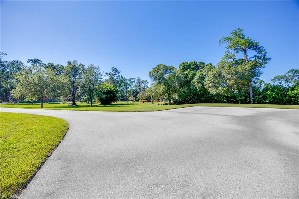 4885 Tamarind Ridge Drive Naples, FL 34119 - Photo 35 of 39 a view of a park with a large trees