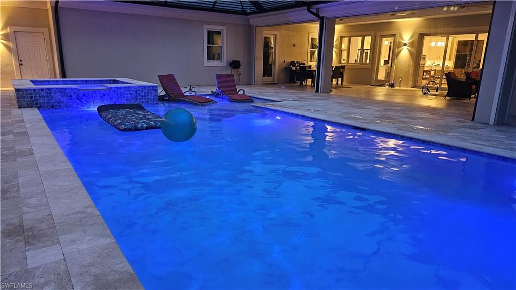 4885 Tamarind Ridge Drive Naples, FL 34119 - Photo 36 of 39 a room with furniture and large windows