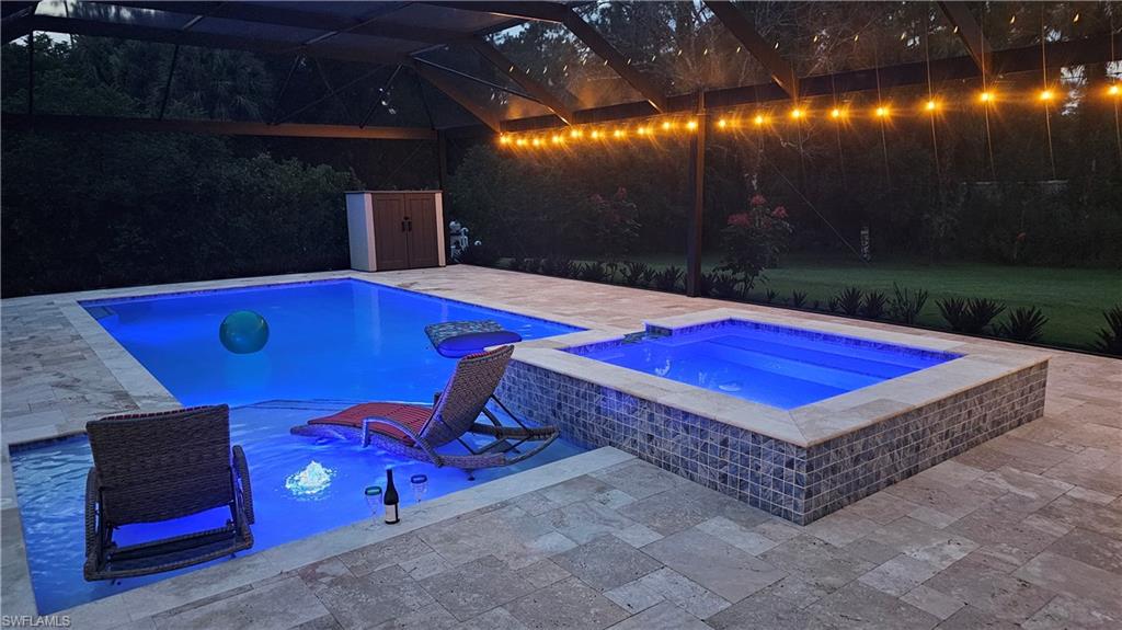 4885 Tamarind Ridge Drive Naples, FL 34119 - Photo 37 of 39 a view of a pool with a yard