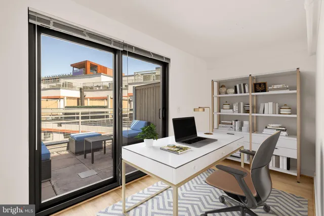 a view of a workspace with furniture