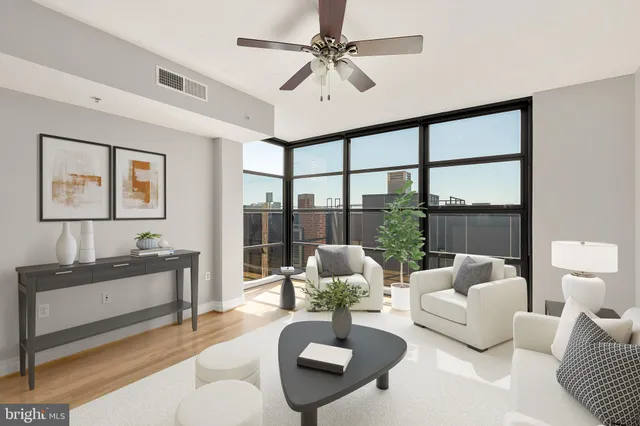 a living room with furniture and a large window