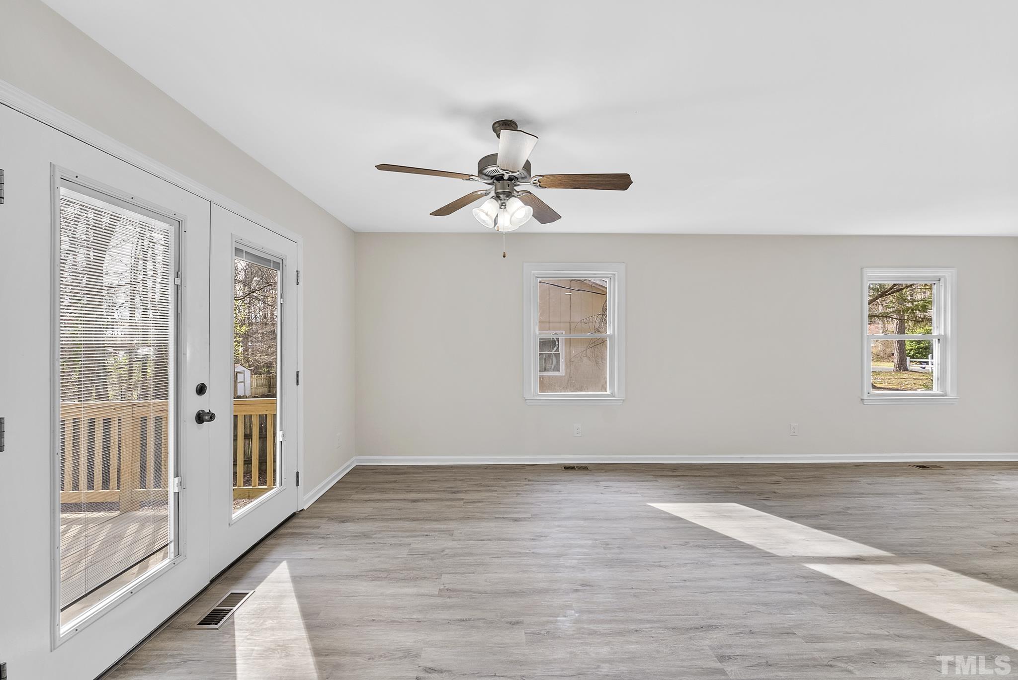 2125 Strebor Street Durham, NC 27705 - Photo 11 of 38 wooden floor in an empty room with a window