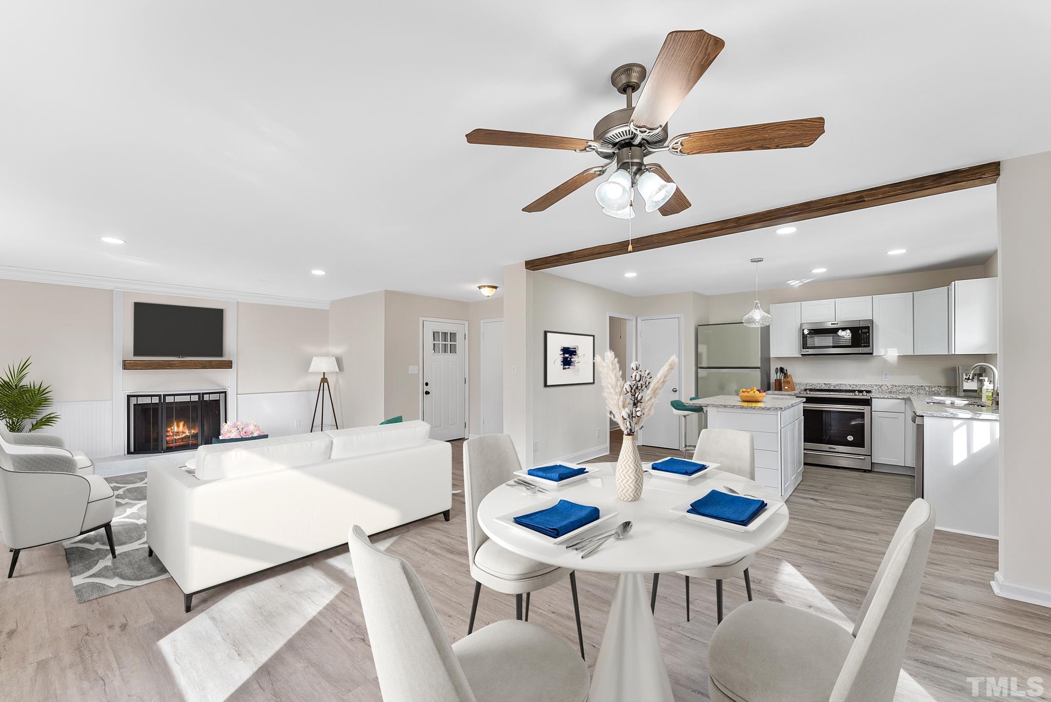 2125 Strebor Street Durham, NC 27705 - Photo 12 of 38 a living room with stainless steel appliances kitchen island furniture and a view of kitchen