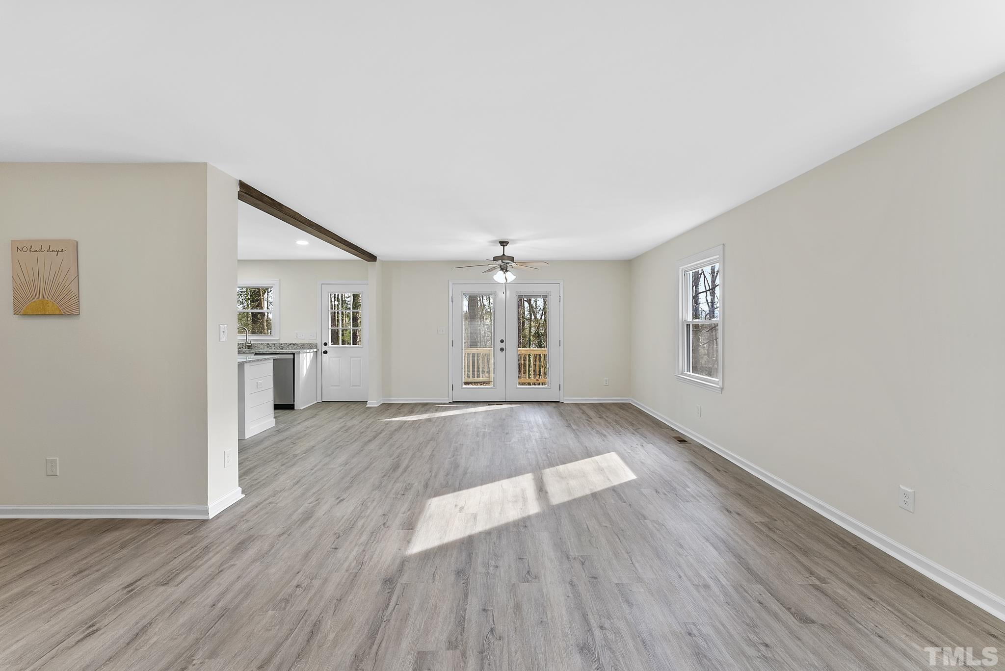 2125 Strebor Street Durham, NC 27705 - Photo 14 of 38 a view of an empty room with wooden floor and a window