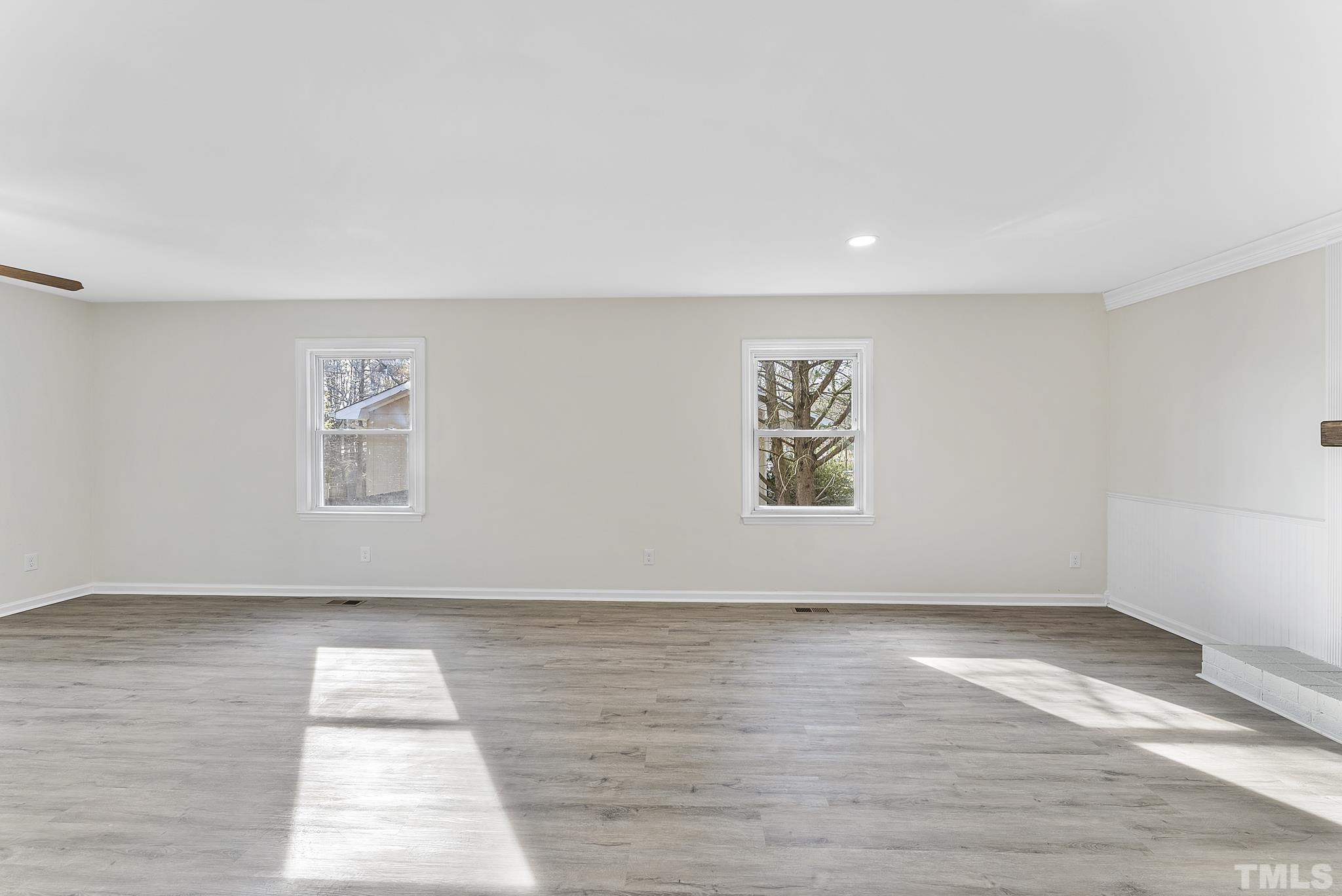 2125 Strebor Street Durham, NC 27705 - Photo 17 of 38 a view of an empty room with wooden floor and a window