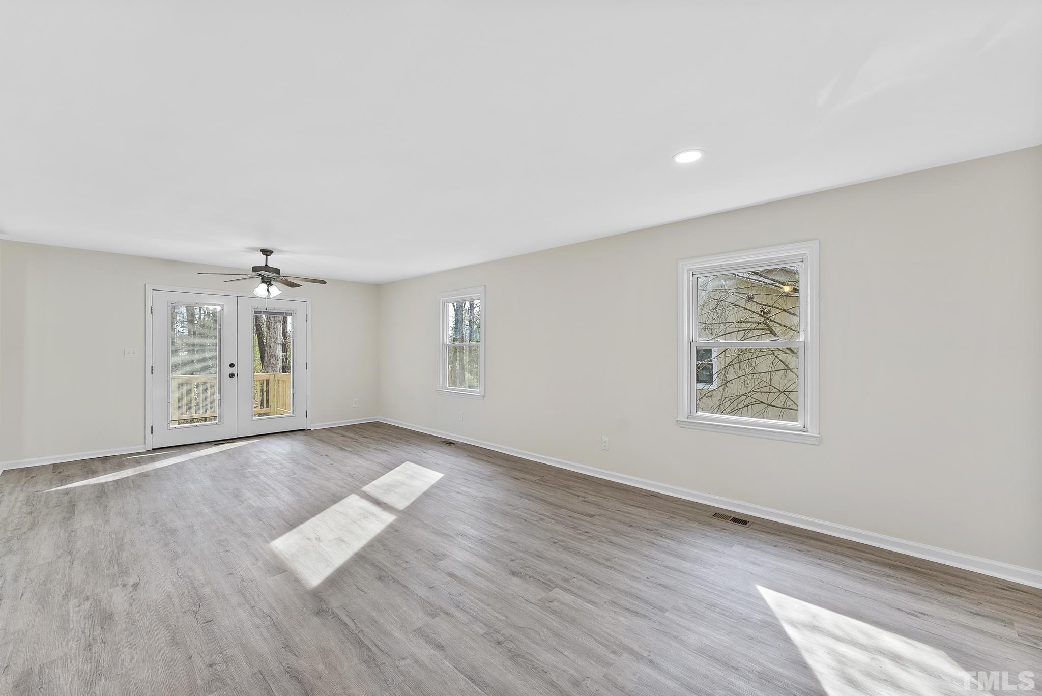 2125 Strebor Street Durham, NC 27705 - Photo 18 of 38 a view of an empty room with a window and wooden floor
