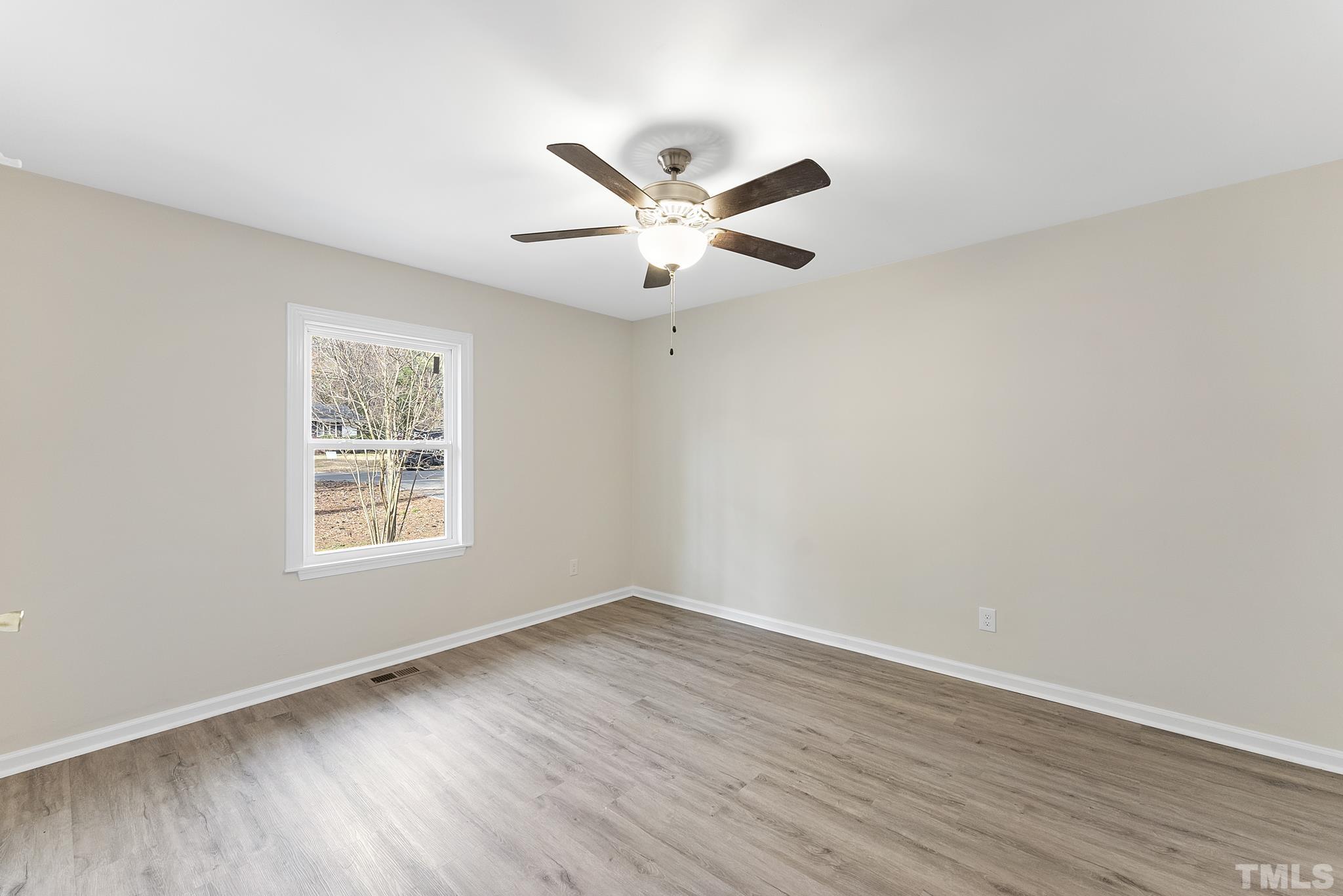2125 Strebor Street Durham, NC 27705 - Photo 21 of 38 wooden floor in an empty room with a window