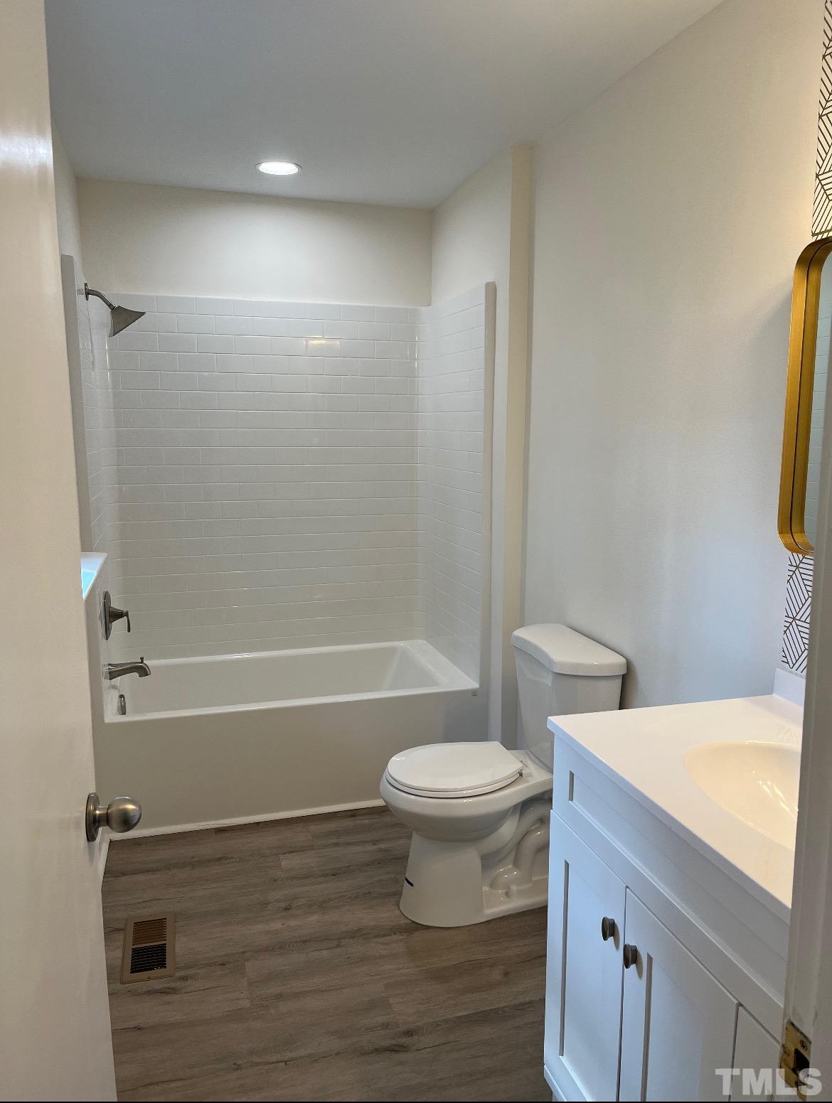 2125 Strebor Street Durham, NC 27705 - Photo 25 of 38 a bathroom with a sink a toilet and shower