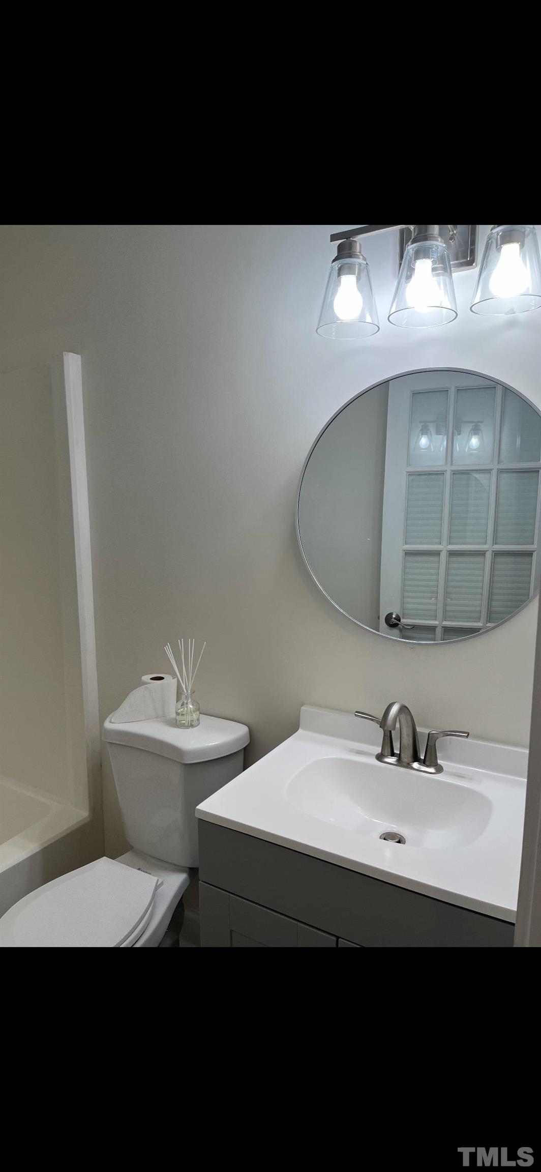 2125 Strebor Street Durham, NC 27705 - Photo 28 of 38 a bathroom with a sink and a mirror