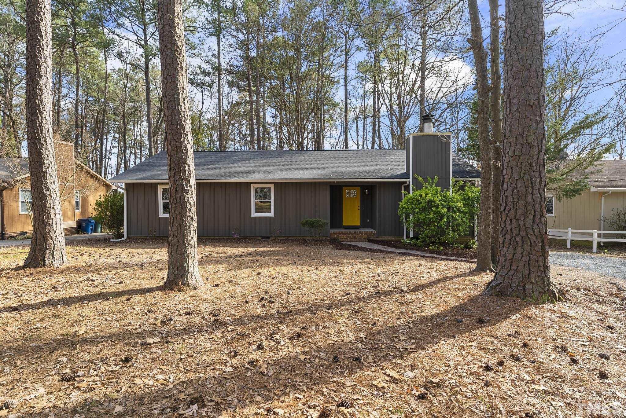 2125 Strebor Street Durham, NC 27705 - Photo 3 of 38 a front view of a house with a yard and large tree
