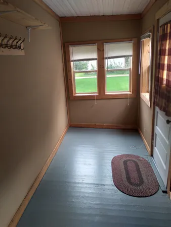 a room with window and a wooden floor